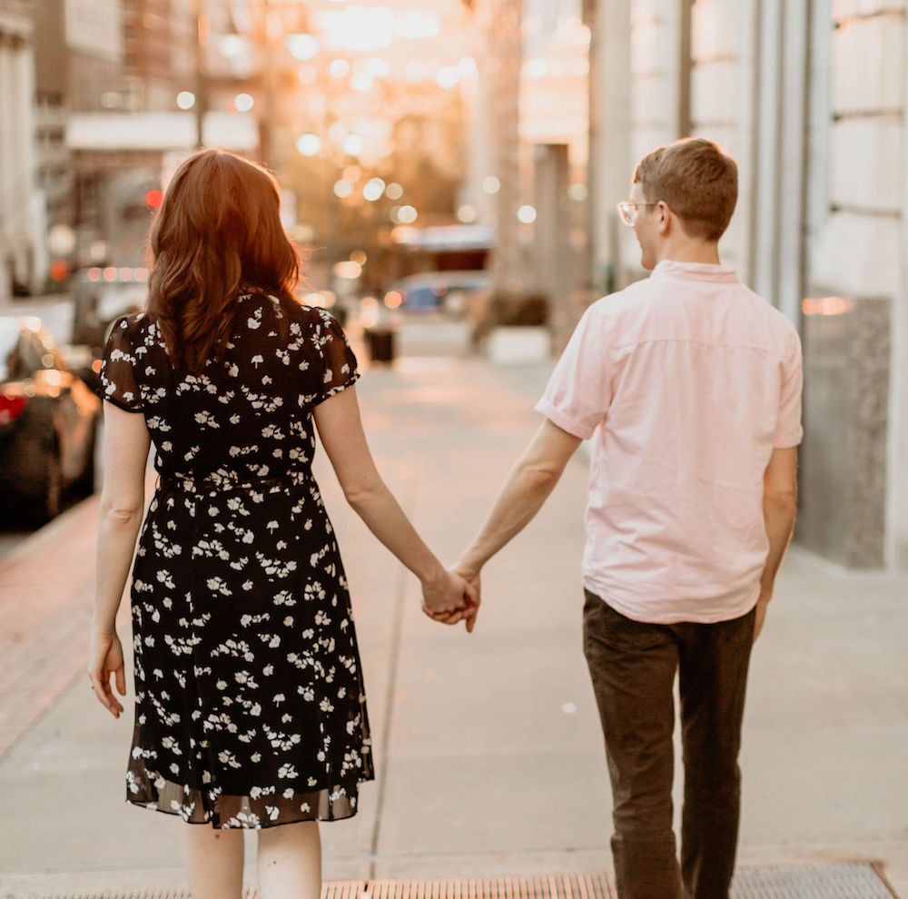 Madeleine and Bobby holding hands in downtown Kansas City, Missouri. Credit: Keshia Pietz